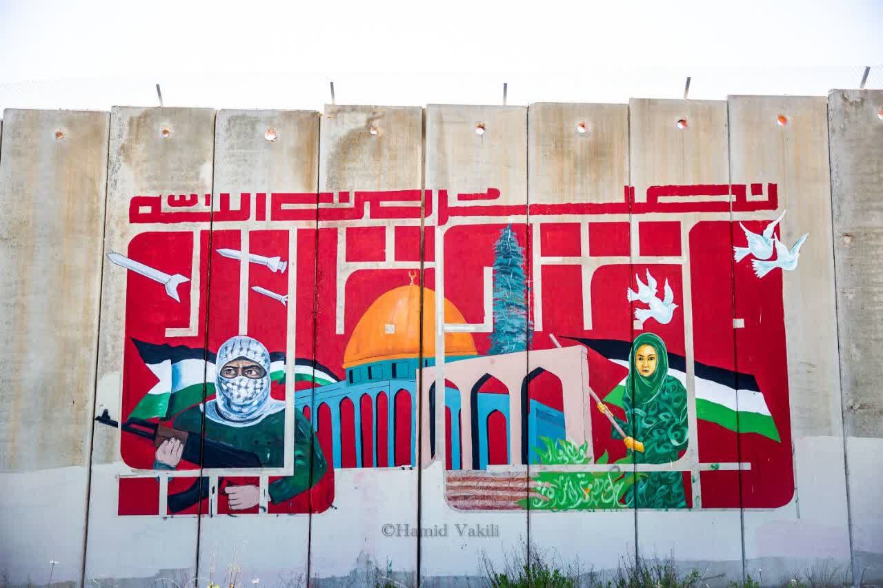«و فتح قریب» بر دیوار حائل با فلسطین اشغالی نقش بست