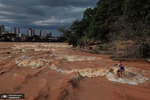 موج سواری در رود دوسی در والاراس برزیل. عکس: Douglas Magno/AFP/Getty Images
